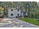 White brick ranch house with a landscaped yard and long driveway at 1770 Austin Dr, Decatur, GA 30032