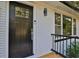 Black front door with glass panels and modern hardware at 1770 Austin Dr, Decatur, GA 30032