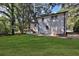 White brick ranch house with a large backyard and deck at 1770 Austin Dr, Decatur, GA 30032