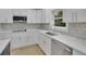 Modern kitchen with white shaker cabinets, quartz countertops, and stainless steel appliances at 1770 Austin Dr, Decatur, GA 30032