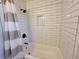 Clean bathroom with a tub and shower, white subway tile at 4488 Ranger Rd, Stone Mountain, GA 30083