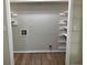 Laundry room with built-in shelving at 470 Ovara Ct, Stone Mountain, GA 30088