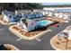 Aerial view of neighborhood pool and clubhouse, surrounded by modern homes and lush greenery at 2133 Kirkham Way, Kennesaw, GA 30152