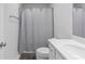 Simple bathroom, shower/tub combo, white vanity, and gray floor at 2133 Kirkham Way, Kennesaw, GA 30152