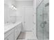 Elegant bathroom with double vanity and frameless shower at 2133 Kirkham Way, Kennesaw, GA 30152