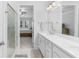 Modern bathroom with double vanity and view into bedroom at 2133 Kirkham Way, Kennesaw, GA 30152