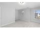 Bright bedroom with neutral wall colors and carpeted floor at 2133 Kirkham Way, Kennesaw, GA 30152