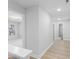 Bright hallway with light hardwood floors and access to bedrooms at 2133 Kirkham Way, Kennesaw, GA 30152