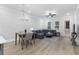 Spacious living room featuring a sectional sofa, coffee table, and hardwood floors at 2133 Kirkham Way, Kennesaw, GA 30152