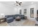 Comfortable living room with sectional sofa and access to backyard at 2133 Kirkham Way, Kennesaw, GA 30152