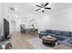 Open living room with kitchen view and hardwood floors at 2133 Kirkham Way, Kennesaw, GA 30152