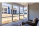 Cozy screened porch, offering a view of the outdoor space, complete with wicker seating and neutral décor at 2133 Kirkham Way, Kennesaw, GA 30152
