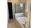 Spa-like bathroom with soaking tub and walk-in shower at 2953 Evanshire Ave, Duluth, GA 30096