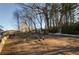 Expansive backyard featuring a chicken coop and ample space for outdoor activities and animal husbandry at 331 Wages Rd, Auburn, GA 30011