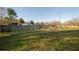 A spacious backyard with a large grassy area, a fence, and garden plots, offering potential for gardening at 331 Wages Rd, Auburn, GA 30011