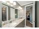 Bathroom featuring a double sink vanity with a granite countertop, vanity, and a walk-in shower at 331 Wages Rd, Auburn, GA 30011