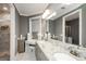 Bathroom featuring a double sink vanity with a granite countertop, vanity, and a walk-in shower at 331 Wages Rd, Auburn, GA 30011