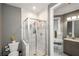 Stylish bathroom showcasing a tiled shower with a glass door and a vanity with drawers at 331 Wages Rd, Auburn, GA 30011
