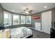 Cozy bedroom illuminated by natural light with multiple large windows and neutral color palette at 331 Wages Rd, Auburn, GA 30011
