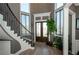 Elegant foyer with curved staircase, hardwood floors, and abundant natural light at 331 Wages Rd, Auburn, GA 30011