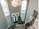 Elegant foyer with curved staircase, hardwood floors, and abundant natural light at 331 Wages Rd, Auburn, GA 30011