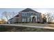 Stunning brick home featuring grand entrance, arched windows, and meticulously maintained lawn at 331 Wages Rd, Auburn, GA 30011