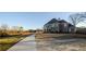 Beautiful property featuring a long driveway leading to an impressive home with arched windows at 331 Wages Rd, Auburn, GA 30011