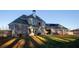 Beautiful home exterior featuring a well-manicured lawn, large windows and an outdoor patio at 331 Wages Rd, Auburn, GA 30011