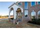 Grand entrance features brickwork, a covered portico, and elegant double doors for a stately welcome at 331 Wages Rd, Auburn, GA 30011