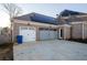Three-car garage with solar panels above, offering ample parking and modern energy efficiency at 331 Wages Rd, Auburn, GA 30011