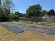 Spacious garden area with black ground cover and raised garden beds at 331 Wages Rd, Auburn, GA 30011