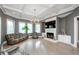 Spacious living room featuring fireplace, coffered ceilings, and comfortable seating at 331 Wages Rd, Auburn, GA 30011