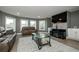 Spacious living room with comfortable sofas, a flat screen tv, and plenty of natural light at 331 Wages Rd, Auburn, GA 30011
