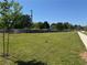 Large vacant lot featuring young trees and a sidewalk at 331 Wages Rd, Auburn, GA 30011