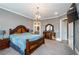 Main bedroom featuring carpet flooring, a television, and dark wood furniture at 331 Wages Rd, Auburn, GA 30011