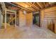 Unfinished basement with visible beams offers potential for customization and storage at 50 Dogwood Ln, Covington, GA 30014