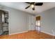 Well-lit bedroom with hardwood floors and access to bathroom at 50 Dogwood Ln, Covington, GA 30014