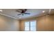 Bedroom with ceiling fan and window blinds at 5385 Highland Gate Nw Dr, Suwanee, GA 30024