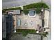 Beautiful aerial view of a backyard oasis, featuring a pool, patio, and outdoor kitchen area at 9060 Selborne Ln, Chattahoochee Hills, GA 30268