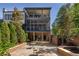 Private backyard with two story screened porch and patio at 9060 Selborne Ln, Chattahoochee Hills, GA 30268