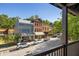 View from balcony showing street, shops and parked cars at 9060 Selborne Ln, Chattahoochee Hills, GA 30268