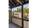 Balcony view of shops and trees in a quaint town at 9060 Selborne Ln, Chattahoochee Hills, GA 30268