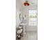 Charming bathroom with pedestal sink, beadboard, and light wood floors at 9060 Selborne Ln, Chattahoochee Hills, GA 30268