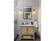 Modern bathroom with penny round tile, a floating vanity, and a glass shower at 9060 Selborne Ln, Chattahoochee Hills, GA 30268