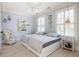 Serene bedroom with light walls, two beds, and light wood floors at 9060 Selborne Ln, Chattahoochee Hills, GA 30268