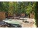 Landscaped courtyard with fountain, seating, and dining areas at 9060 Selborne Ln, Chattahoochee Hills, GA 30268