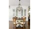 Bright dining area with round wooden table and four chairs at 9060 Selborne Ln, Chattahoochee Hills, GA 30268