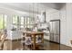 Modern kitchen with stainless steel appliances and farmhouse sink at 9060 Selborne Ln, Chattahoochee Hills, GA 30268
