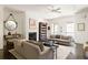 Spacious living room with hardwood floors, fireplace, and ample natural light at 9060 Selborne Ln, Chattahoochee Hills, GA 30268