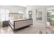 Spacious main bedroom with king-size bed and access to balcony at 9060 Selborne Ln, Chattahoochee Hills, GA 30268
